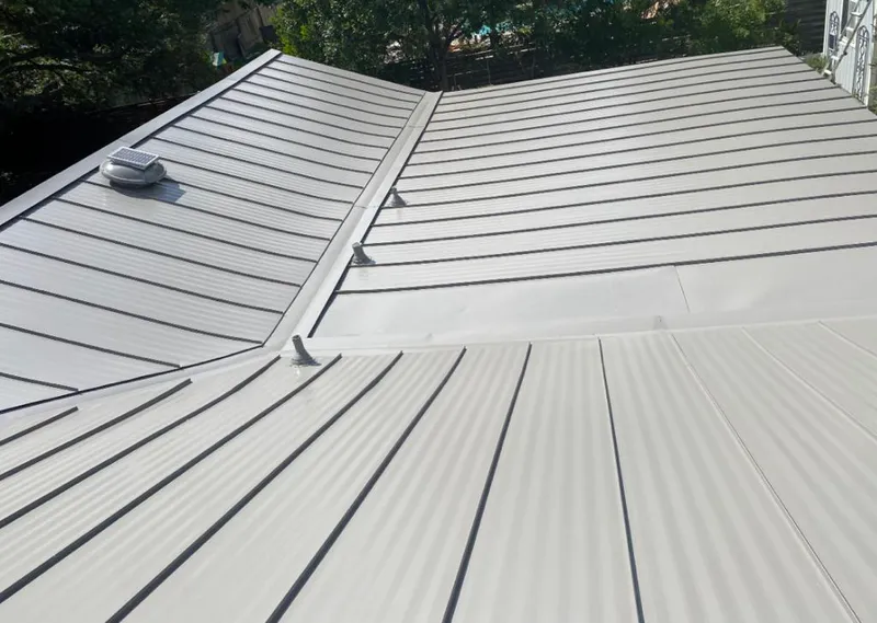 Solar attic fan installed on a metal roof for Roof Ventilation in Santa Fe
