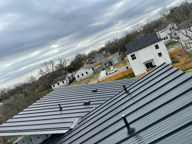 Standing seam metal roof panels with vents for Skylight Repair in Santa Fe